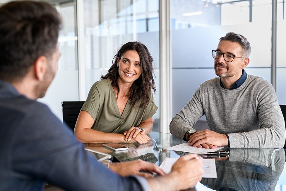 Three people having a business meeting.